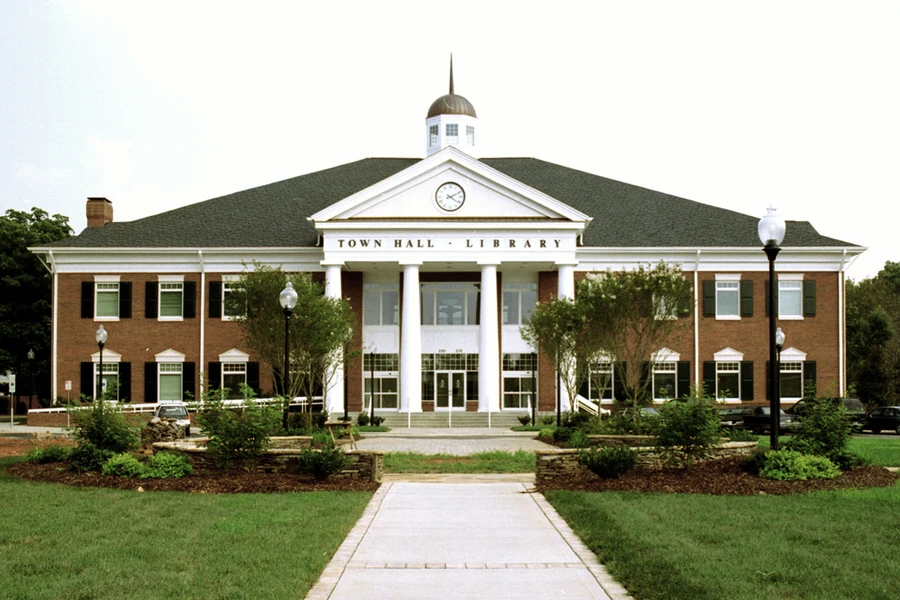 The Matthews Town Hall and Library building with white columns in Matthews, North Carolina